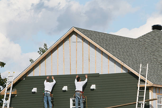 Professional Siding technician working in Luxor, PA